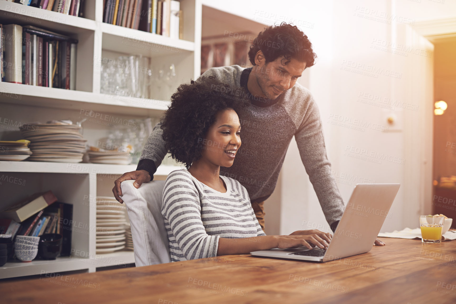 Buy stock photo Shot of a couple using a laptop at home