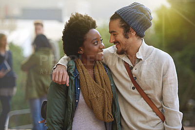 Buy stock photo Students, university and love of interracial couple on campus with hug and embrace together outdoor. College, school education and diversity with a happy smile ready for class study with support