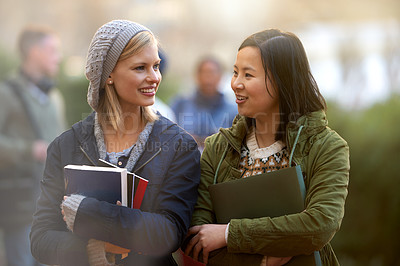 Buy stock photo School, books and conversation with woman friends outdoor on campus together for learning or development. College, education or university with young student and best friend talking at recess break