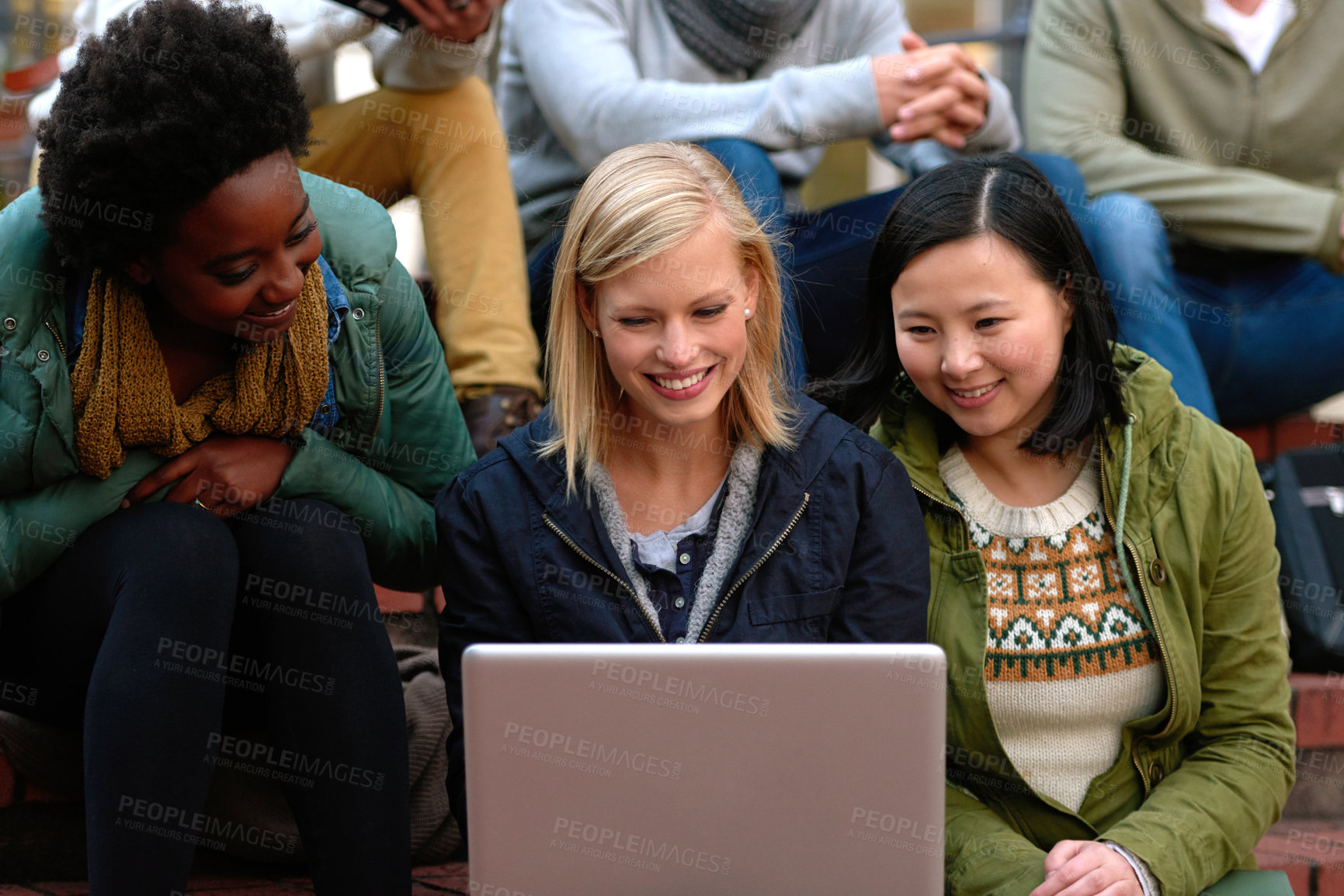 Buy stock photo University, women and laptop on stairs outdoor for research, relax or break on campus with social media. College, students and smile with technology for internet, streaming or learning and diversity