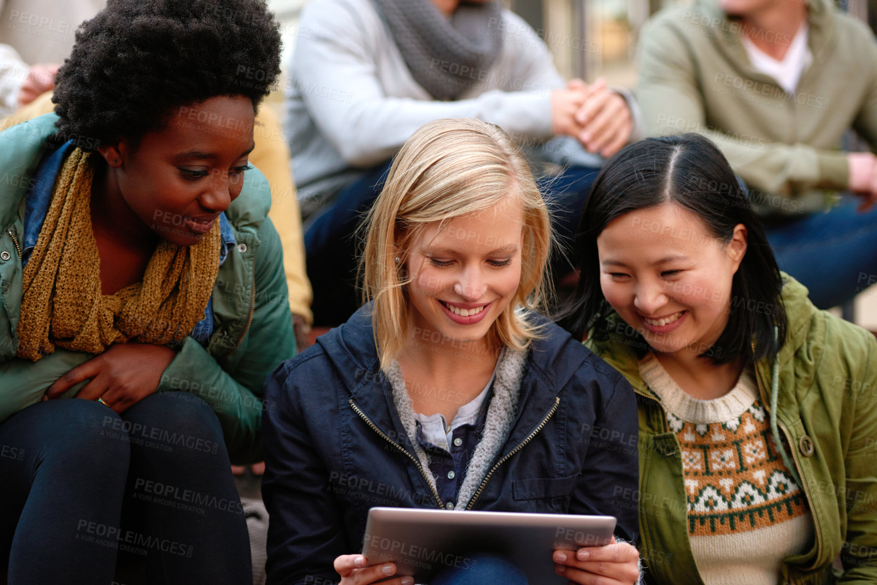 Buy stock photo University, friends and smile with tablet outdoor for research, relax or break on campus with social media. College, people and happy with technology for internet, streaming or learning and diversity