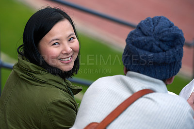 Buy stock photo Back view, Asian woman and university student outdoor, smile and sitting with friend to relax, chill and think. College, campus and share information to study with tips and notes for education