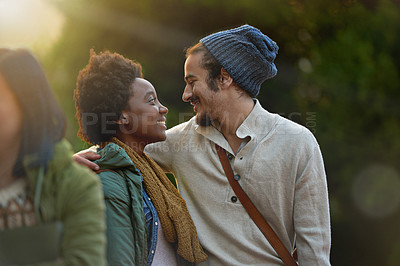Buy stock photo Love, park and happy interracial couple together with hug, bag or morning commute to university with smile. College, students and romance in nature, man and woman with diversity, sunshine and embrace