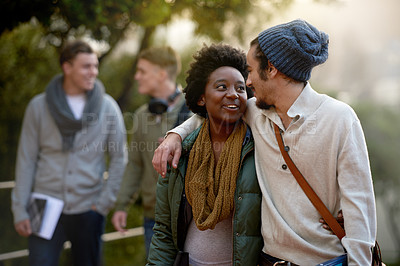 Buy stock photo Students, university and talking of interracial couple of friends on campus with hug and an embrace together. College, school education and diversity with a happy smile ready for class outdoor