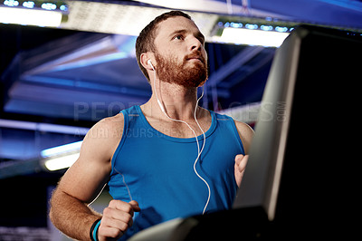 Buy stock photo Earphones, runner and man running on treadmill in gym for health, wellness and body weight loss. Exercise, fitness and male athlete with cardio workout on machine for race training in sports center.