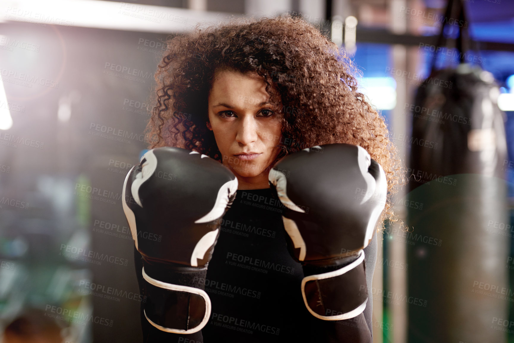 Buy stock photo Portrait, serious boxer and woman in gym for exercise, training or workout for healthy body at club. Face, fight and female person with gloves for sport, wellness or practice for fitness in Spain