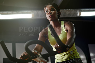 Buy stock photo Cycling, workout or black woman on bike machine for cardio training, exercise or energy for endurance. Development, gym or healthy African sports person in club for fitness, challenge or wellness