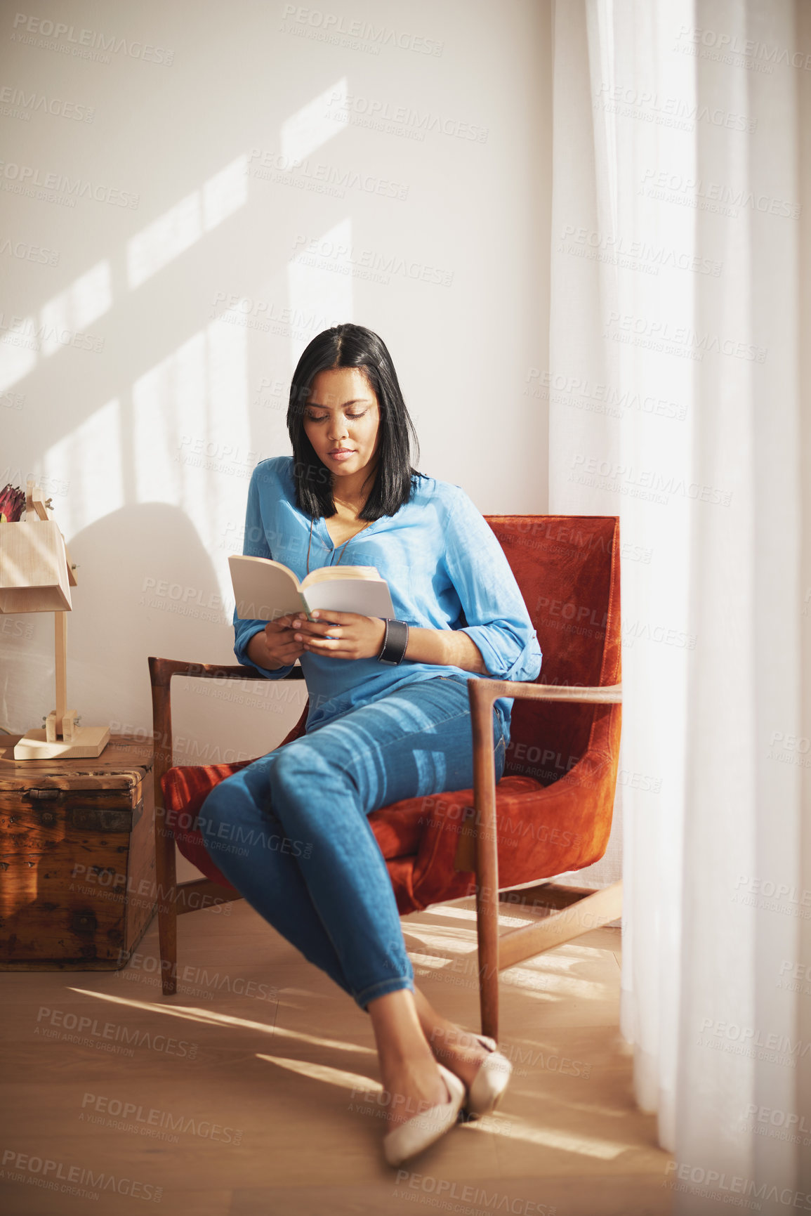 Buy stock photo Home, woman and reading book on chair for information, knowledge or literature in living room. Story, relax and female person with novel on couch for hobby, entertainment or education in apartment