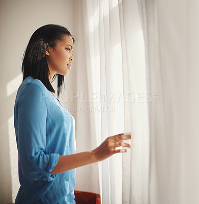 Buy stock photo Stress, african woman, looking at living room window with anxiety, confused and worry. Curious, female person and waiting for partner, spying through curtain with concern or fear for home intruder