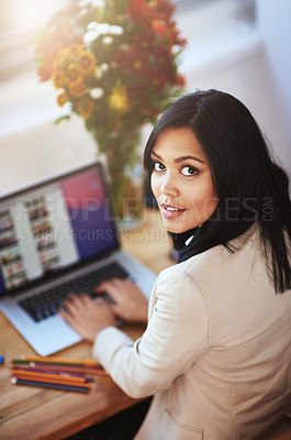 Buy stock photo Portrait of a woman working at her laptop in a home office