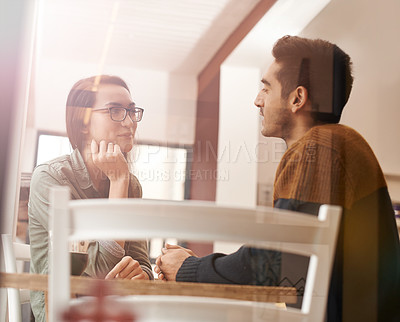 Buy stock photo Couple, relax and talking with date for conversation, bonding or romance at indoor restaurant. Man and woman with smile by window at coffee shop for social communication or chatting together at table