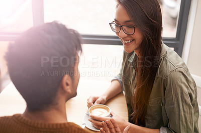 Buy stock photo Couple, date and coffee shop with conversation, smile and talking together with hot drink in a cafe. Woman, social and happy from discussion and chat in a restaurant with tea or cappuccino at table 