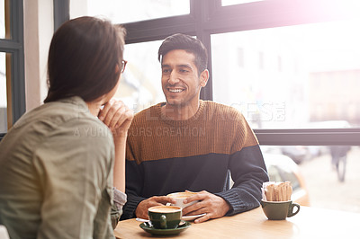 Buy stock photo Coffee shop, happy and couple with drink on date in conversation, talking and chatting for bonding. Love, relax and man and woman with caffeine, cappuccino and beverage in restaurant, cafe and store