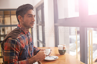 Buy stock photo Serious man, thinking and window with coffee for morning, breakfast or vision at indoor cafe. Young male person in wonder or thought with drink, mug or beverage for caffeine or tea at restaurant