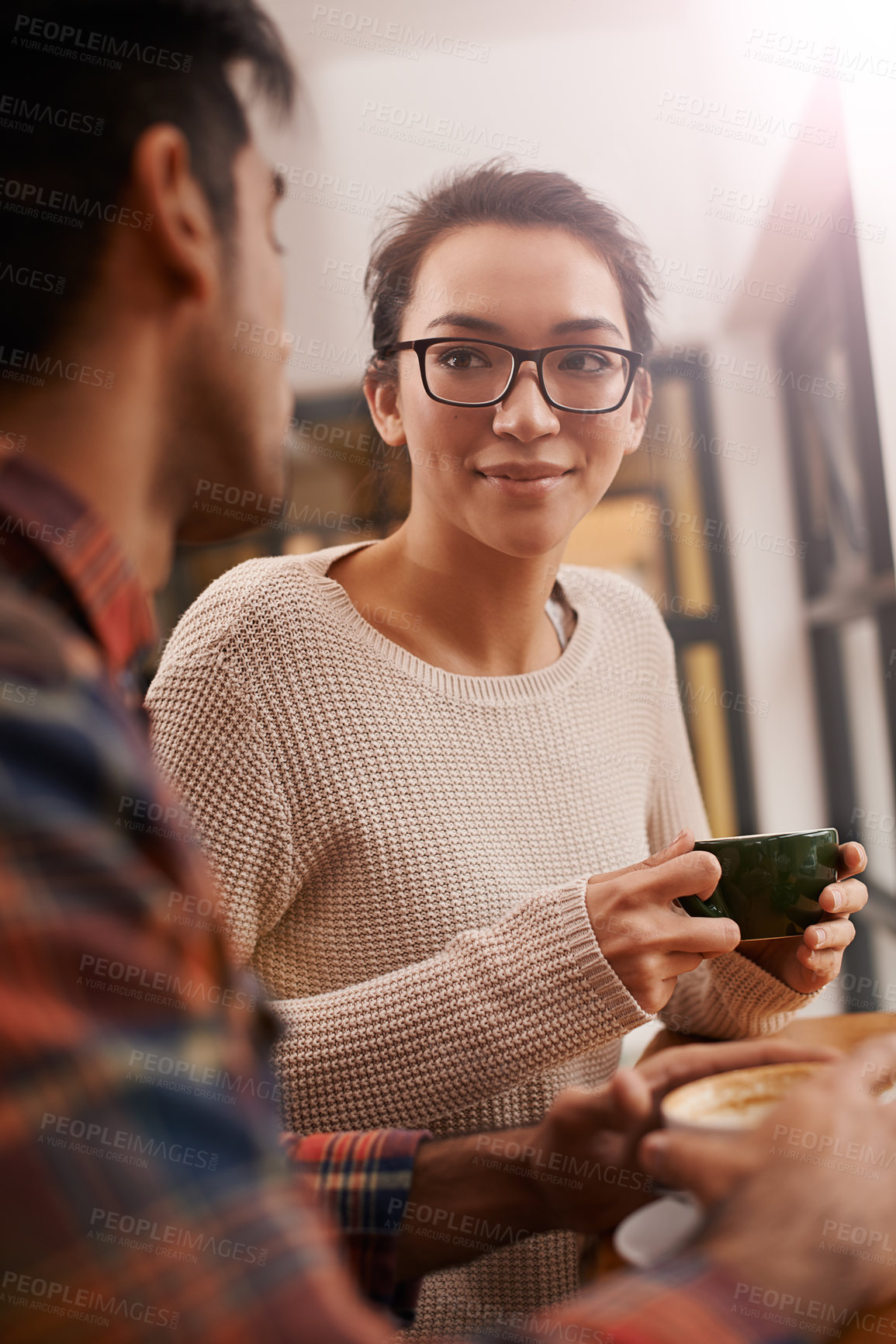 Buy stock photo Couple, date and coffee shop with woman and talking together with hot drink in a cafe. Relationship, smile and mug with discussion and chat in a restaurant with tea or cappuccino at a table 