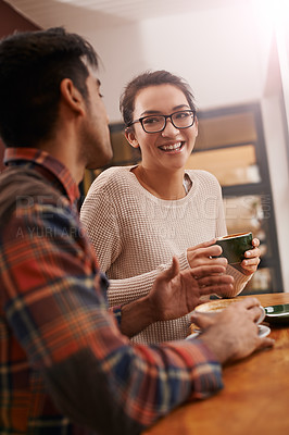 Buy stock photo Couple, date and coffee shop with funny joke and talking together with hot drink in a cafe. Woman, smile and happy from discussion and chat in a restaurant with tea or cappuccino at a table 