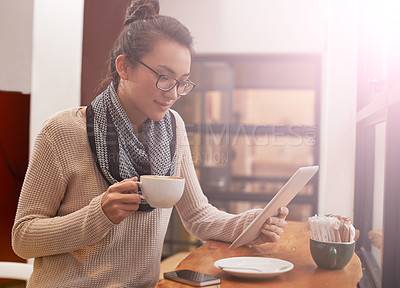Buy stock photo Woman, coffee shop and tablet with freelancer research and social media in cafe with cappuccino. Website, drink and internet with digital blog writer and technology at restaurant with tea and reading