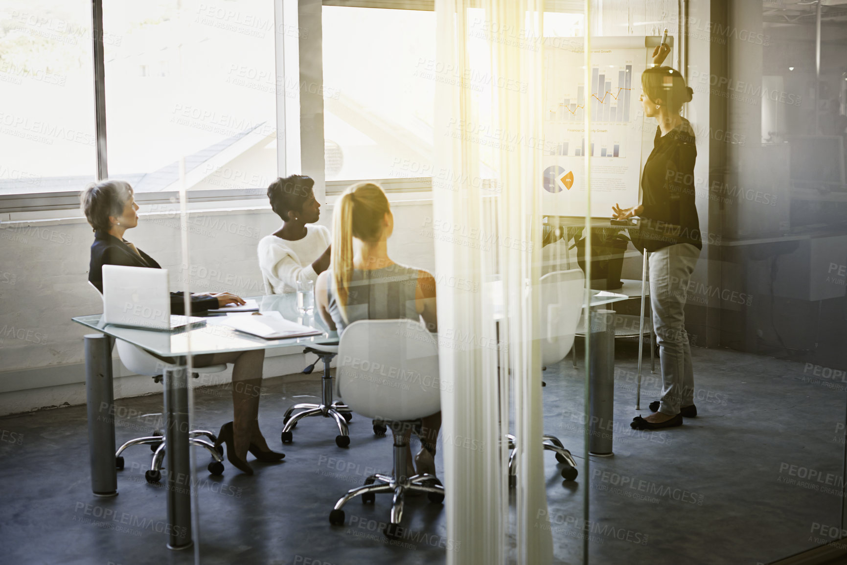 Buy stock photo Shot of a businesswoman giving a presentation in the boardroom