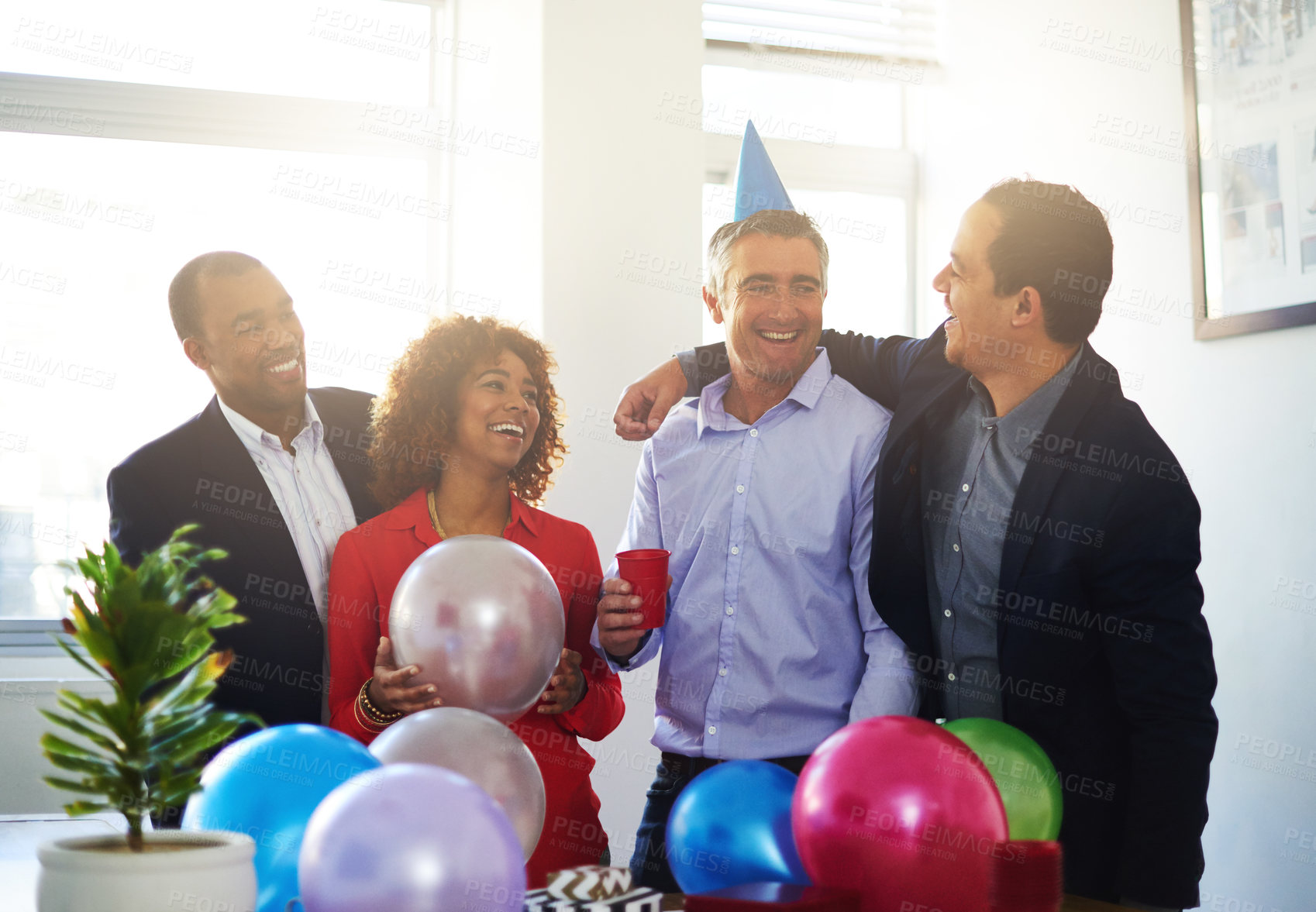Buy stock photo Shot of a coworkers having a office birthday party