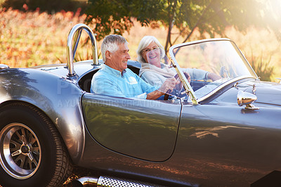 Buy stock photo Cropped shot of a senior couple driving through the countryside