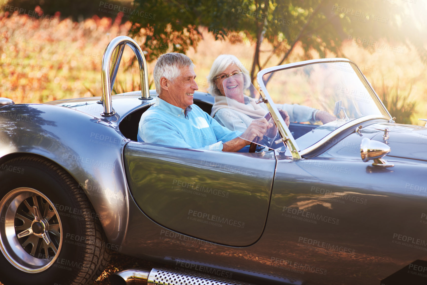 Buy stock photo Cropped shot of a senior couple driving through the countryside