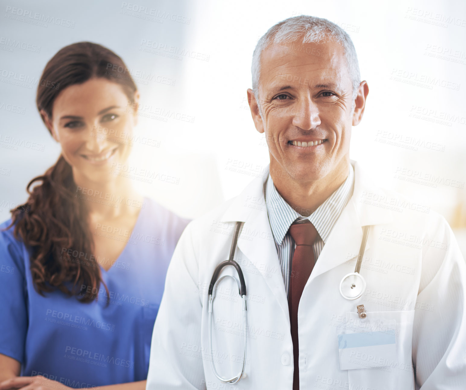 Buy stock photo Doctor, man and nurse in portrait, happy and confident for medical support, wellness or care in hospital. Medic, surgeon and woman in team, smile and health services in clinic with pride for career