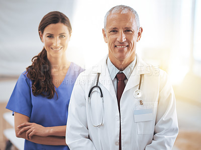 Buy stock photo Doctors, man and woman in portrait at hospital for medical support, wellness and arms crossed with smile. Medic, surgeon and nurse in team, happy and health services in clinic with pride for career
