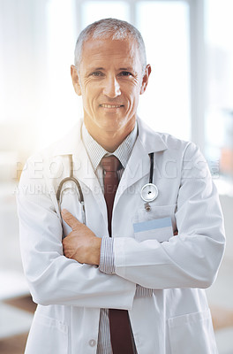 Buy stock photo Healthcare, portrait and doctor with arms crossed in hospital for support, services and wellness. Medicine, lens flare and happy mature medical professional for confident, help and treatment