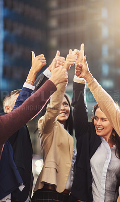Buy stock photo Cropped shot of a group of colleagues giving thumbs up outside