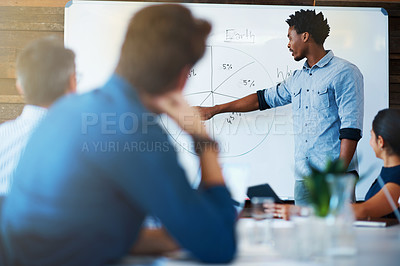 Buy stock photo Planning, businessman with graph and with colleagues in a meeting room of their workplace. Data review or results, coaching or training at workshop and coworkers working together in a conference room
