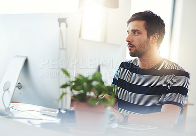 Buy stock photo Shot of a designer working at his computer