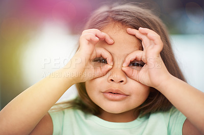 Buy stock photo Portrait, child and circle with hands on eyes for playful or silly facial expression, funny and happiness. Girl kid, adorable with gesture on face for vision or glasses, youth and childhood with fun.