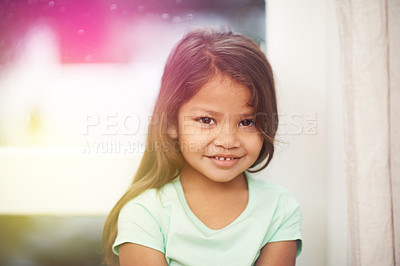 Buy stock photo Girl, kid and smile for portrait in home, cute and sweet in lounge with happiness in family house. Female young person, adorable and innocent in living room for child development, youth and childhood