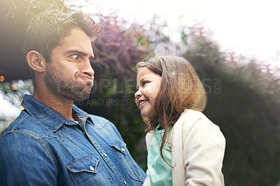 Buy stock photo Father, funny and face with girl outdoors for silly or goofy moment together, laughter and happiness for dad or daughter bonding. Parent, kid and backyard for game with comic expression and comedy.