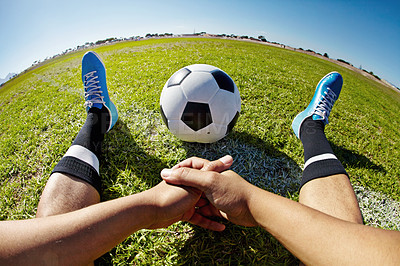 Buy stock photo Sport, pov and shoes of man with soccer ball outdoor, relax and resting after fitness or training. Football, field and hands of male player relaxing on grass at park after workout, match or sports