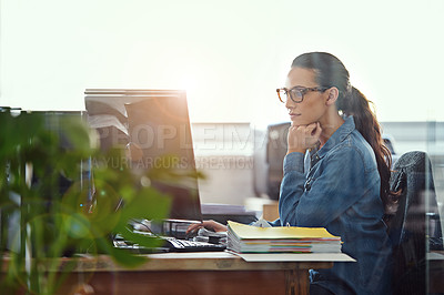 Buy stock photo Cropped shot of a businesswoman working at her desk
