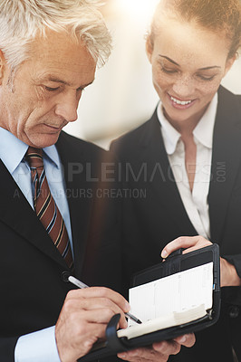Buy stock photo Leader, showing and notebook to worker in workplace for business in corporate company for strategy. Woman, smile and talking to boss in office, happy and professional in clothes for work or job