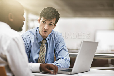 Buy stock photo Laptop, serious conversation and business men in the boardroom for meeting to discuss the company vision. Collaboration, computer and review with an employee team sitting together in the office