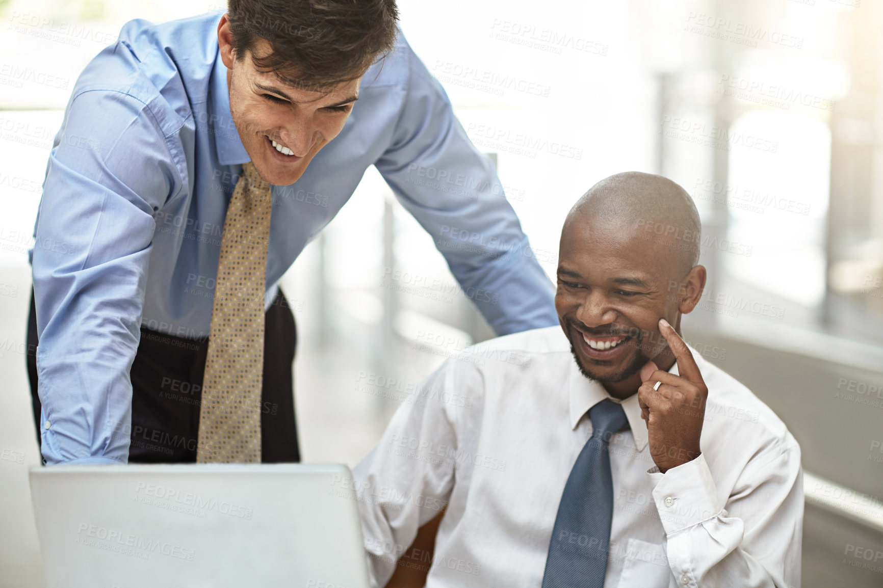 Buy stock photo Cropped shot of two businessmen discussing work in the office