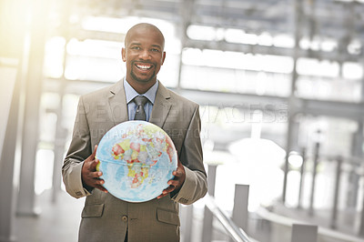 Buy stock photo Cropped portrait of a businessman holding a globe