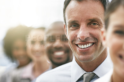 Buy stock photo Cropped portrait of a group of coworkers standing a row
