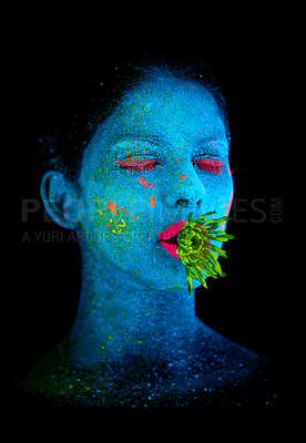 Buy stock photo Neon, paint and face of woman in studio with plant for organic art, plant aesthetic or cosmetics. Glow makeup, person or fluorescent glitter for uv illusion or creative glow on black background