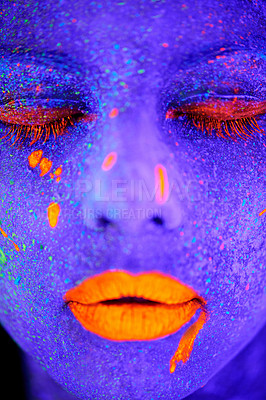 Buy stock photo Neon paint, beauty and woman face closeup with dark background and creative cosmetics. Glow, rave makeup and psychedelic cosmetic of a female model with unique and creativity with art in studio 