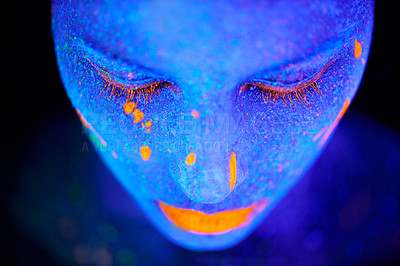 Buy stock photo Art, facial and woman with neon paint in studio for fantasy, creative or psychedelic aesthetic. Illusion, creativity and female model with glitter and bright color facial cosmetics by dark background
