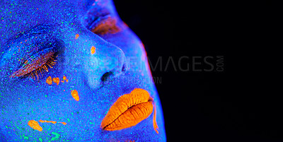 Buy stock photo Neon paint, unique makeup and woman face closeup with dark background and creative cosmetics. Glow, fantasy and psychedelic cosmetic of a female model with mockup and creativity with art in studio 