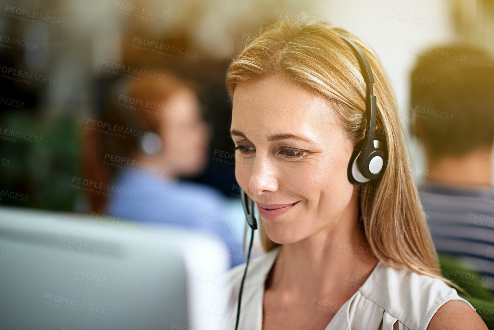 Buy stock photo Cropped shot of a young businesswoman wearing a headset