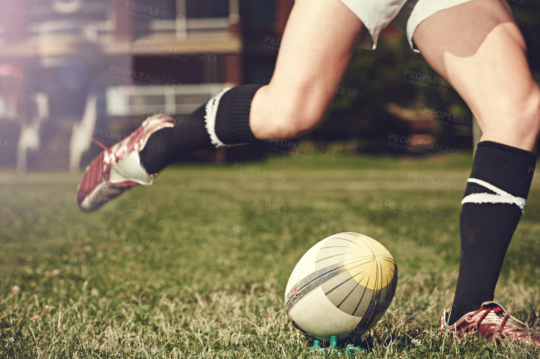 Buy stock photo Rugby, man and feet kick sports ball outdoor on a pitch for action, goal or score. Male athlete person playing in sport competition, game or start training for fitness, workout or exercise on grass