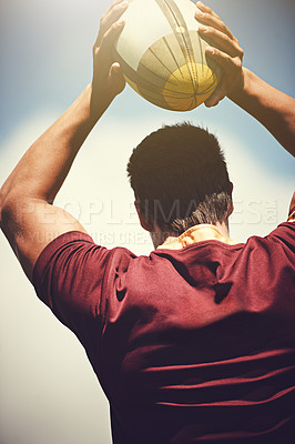 Buy stock photo Rugby ball, sports and man outdoor to play a game, throw and score a goal. Headshot of a male athlete person playing in sport competition or training for fitness, workout or exercise from behind