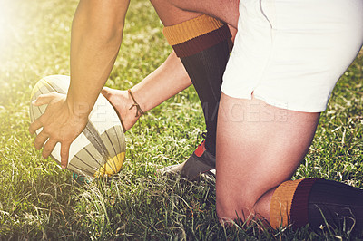 Buy stock photo Rugby, hands closeup and man with a ball outdoor on a pitch for action, goal or start. Male athlete person playing in sport competition, game or training for fitness, workout or exercise on grass