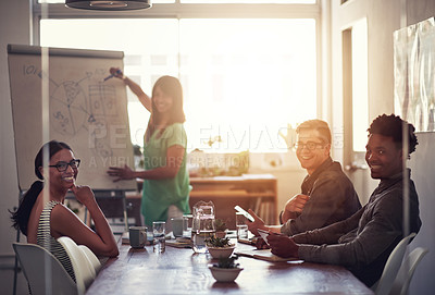 Buy stock photo Happy business woman leader writing on board explaining ideas and thoughts while brainstorming with colleagues. Portrait of diverse colleagues discussing ideas while collaborating on a project